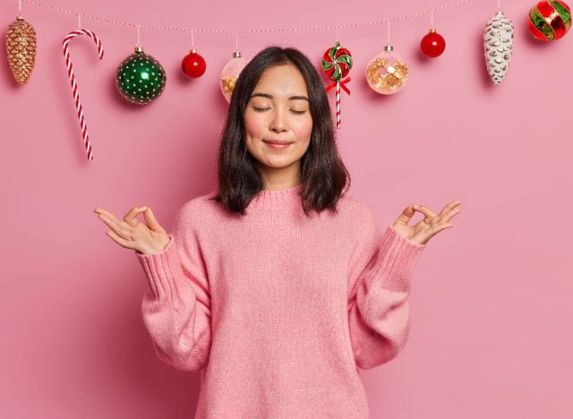 woman meditating during christmas