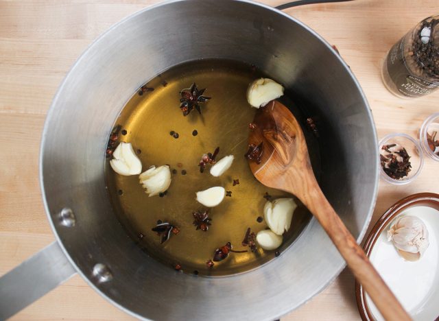 cloves of garlic and cooking spices to make a brine for chicken