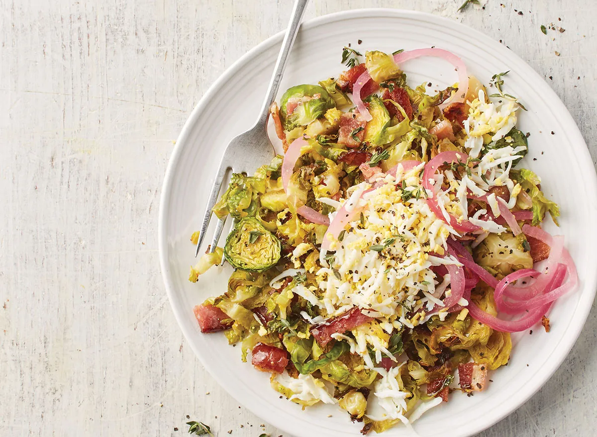 warm brussels sprouts salad with eggs and pickled red onion