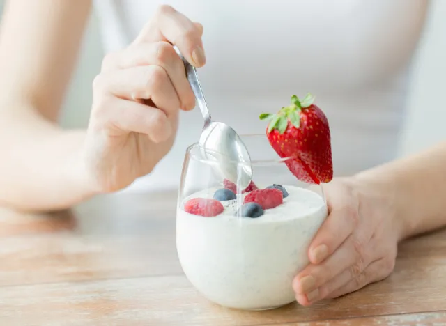 woman eating yogurt, concept can eating yogurt help you lose weight