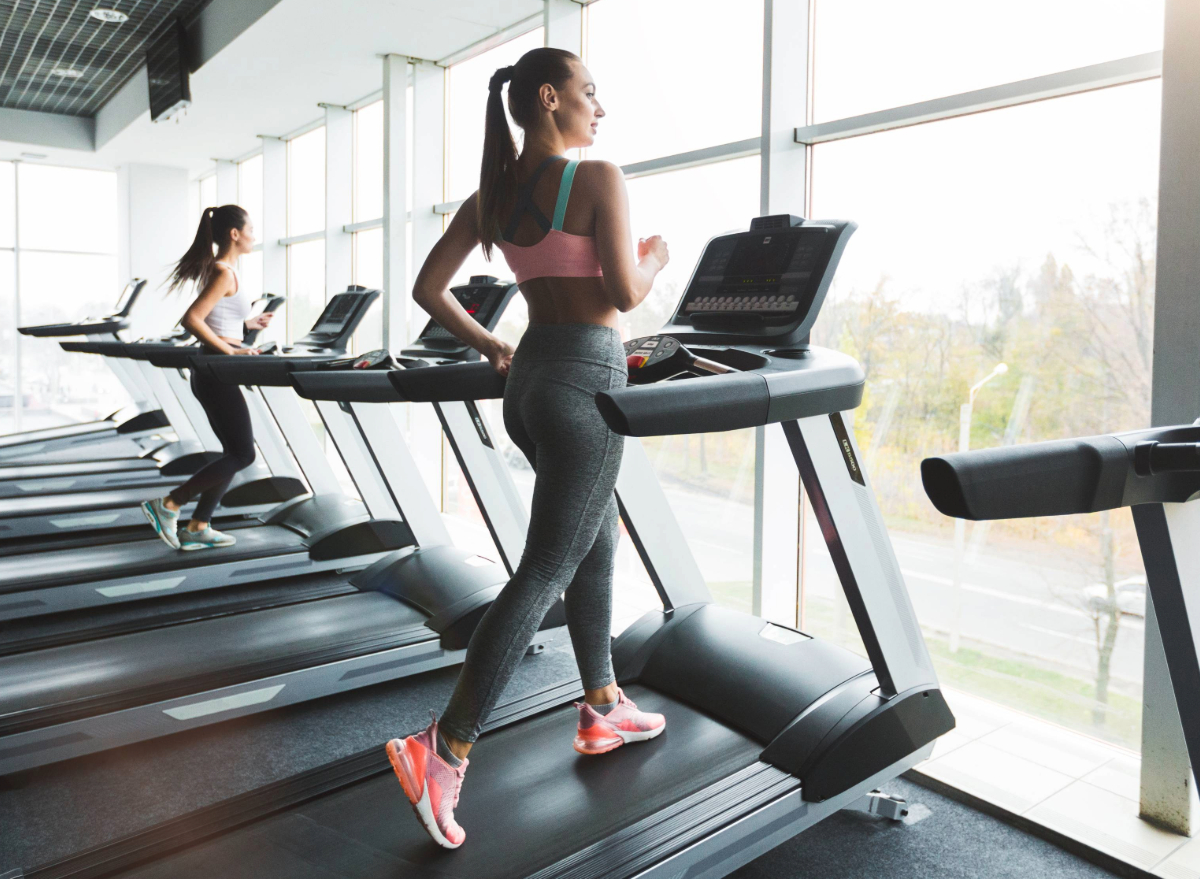 woman power walking on the treadmill, the concept of best gym training for weight loss