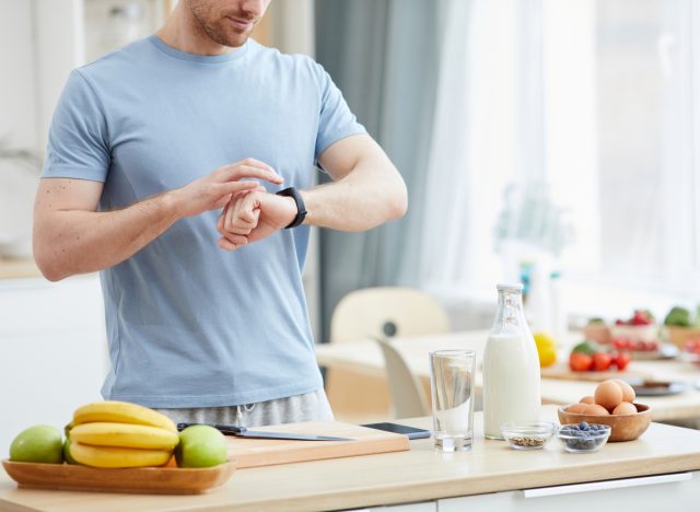 man checking the time before breakfast