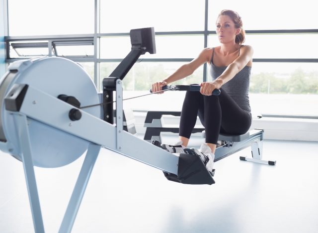 woman exercising on the rowing machine