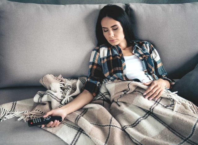 woman asleep on couch after eating