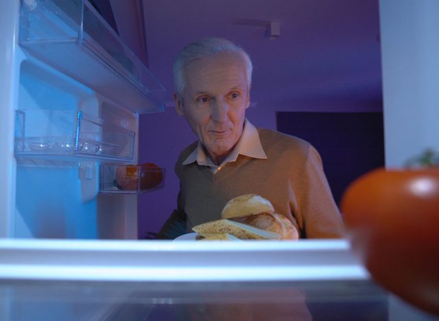 older man snacking late at night