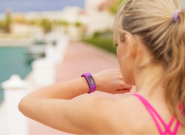 close-up of a woman monitoring her fitness tracker