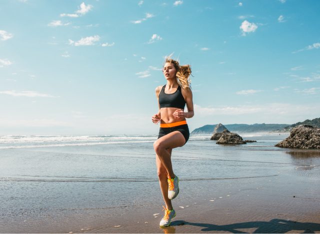 woman doing hiit exercises on the beach, an effective workout for burning fat
