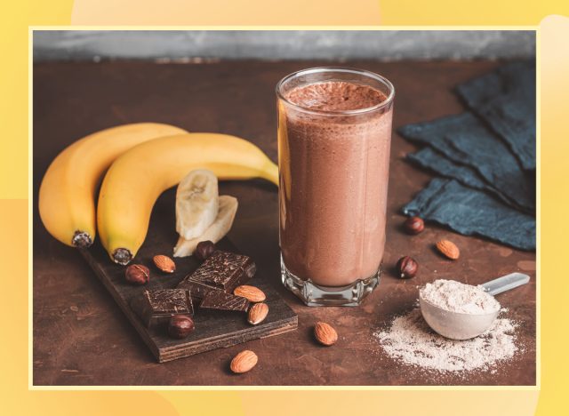 chocolate protein shake made with almond butter and banana on a wooden tabletop