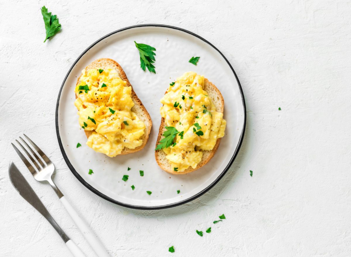 egg and bowl on a plate with a knife and fork
