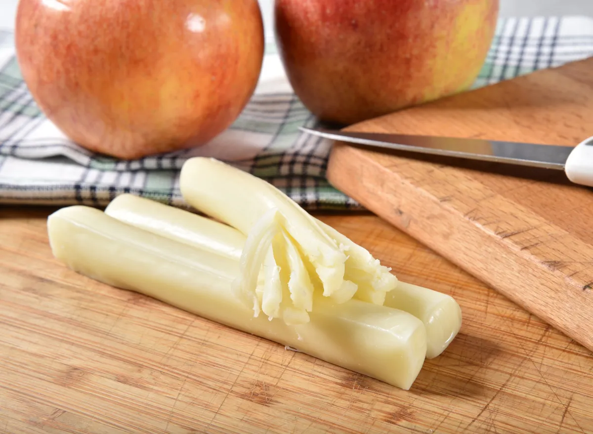String cheese with almonds or apple slices