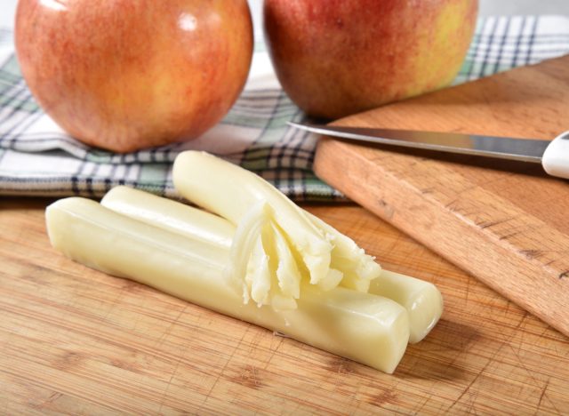 String cheese with almonds or apple slices