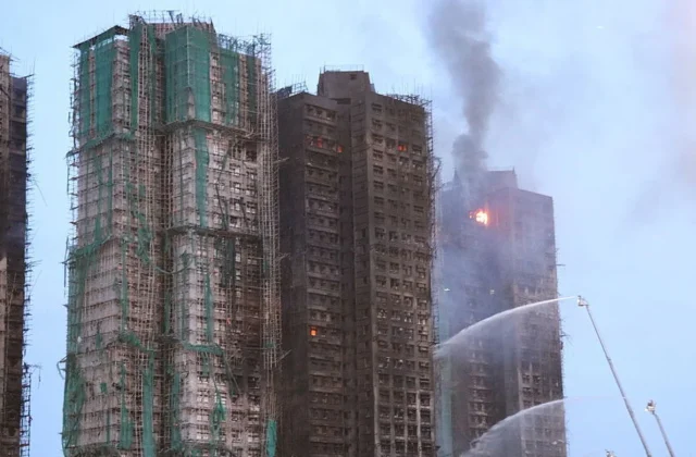 94 dead in Hong Kong blaze as police accuse construction firm of gross negligence