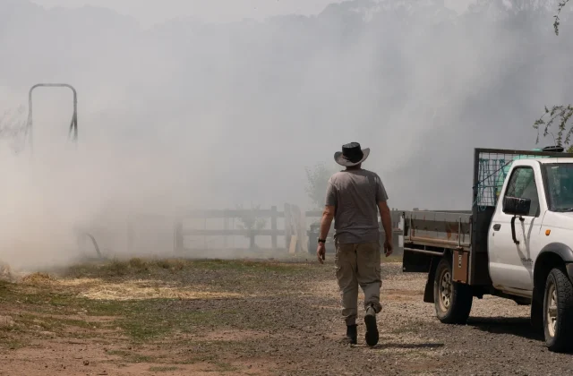 Dozens of homes destroyed, one killed as Australian bushfires rage