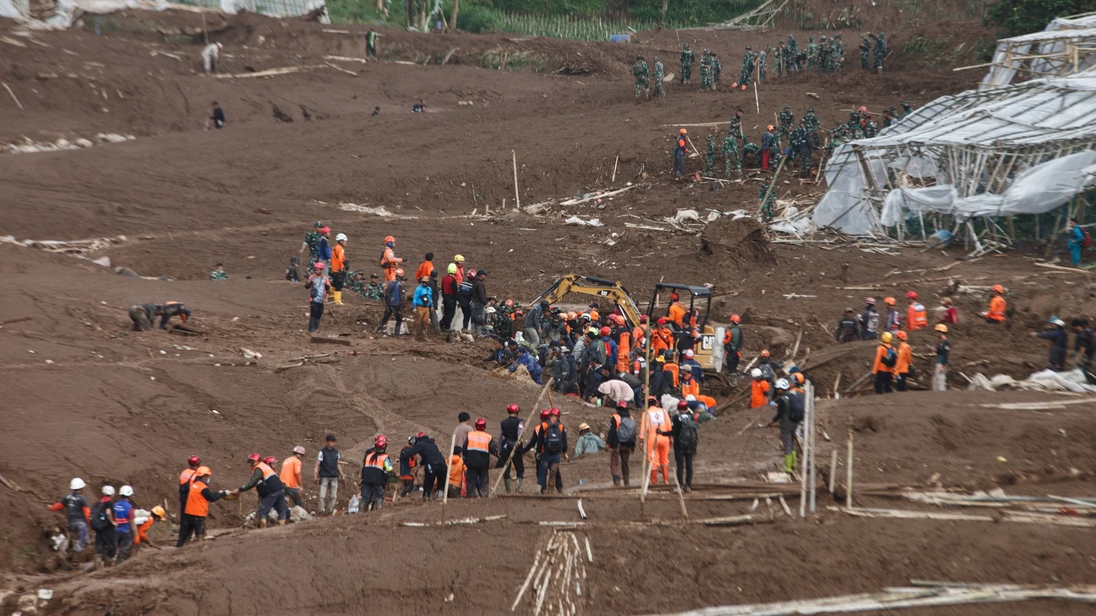 Indonesia landslide kills 17 as search continues for dozens missing