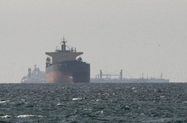 Iran seizes two vessels in Strait of Hormuz after ship comes under fire