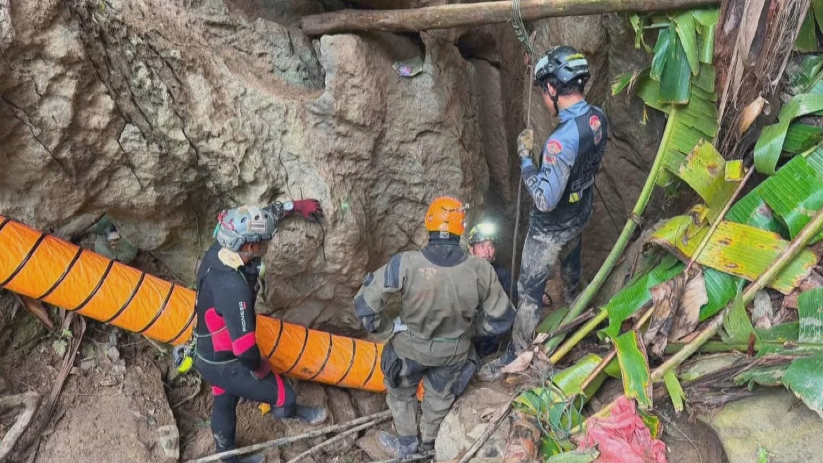 Survivors guide rescuers searching for last two men trapped in Laos cave