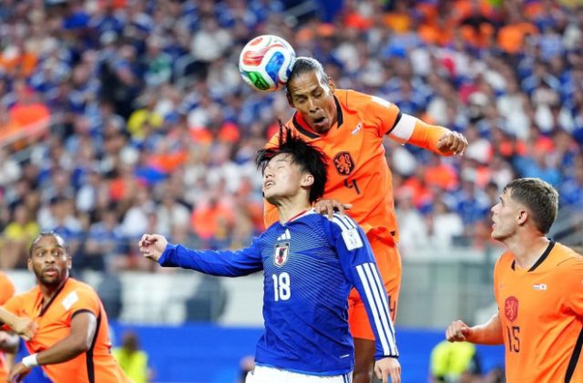 Japan rallies twice to draw Netherlands at World Cup
