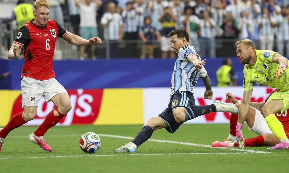 Lionel Messi’s record-breaking goal sends Argentina into last 32