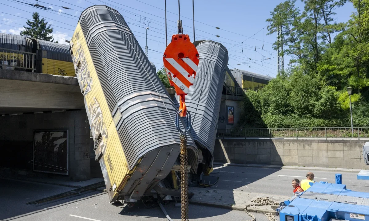 One dead after freight train wagons plunge off bridge in Germany