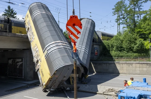 One dead after freight train wagons plunge off bridge in Germany