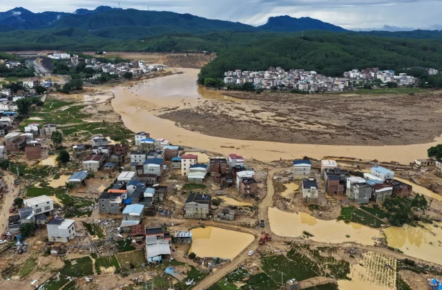 China storm death toll rises as dozens remain missing