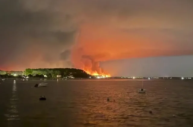 French minister urges travelers not to cancel plans over wildfires