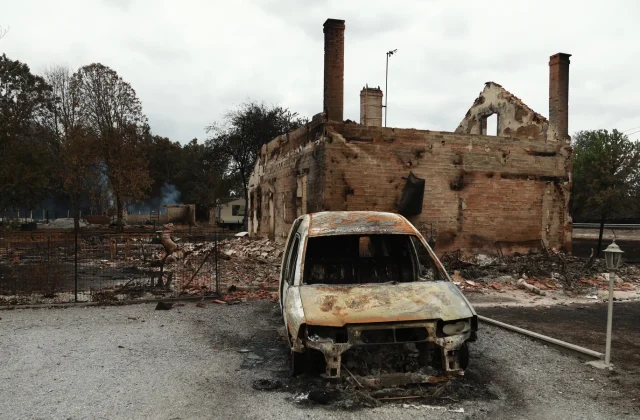 Macron warns of tough weeks ahead as fire continues to rage