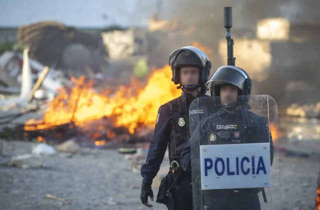 Authorities urge calm after anti-migrant protesters clash with police in Ceuta