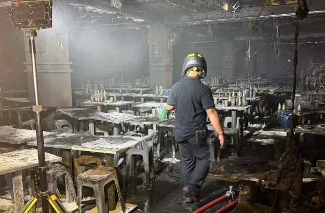 Police Seek Charges Against Bangkok Bar Owner After Fire Kills 37
