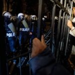 Polish riot police deployed after court chief suspended